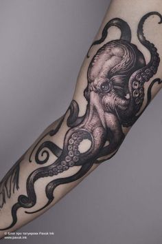 an octopus tattoo on the arm with black and white ink, it is very intricate