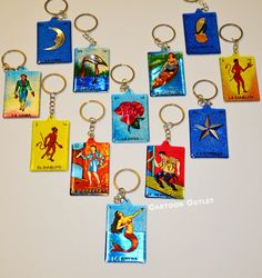 a bunch of key chains that have some pictures on them with charms attached to them