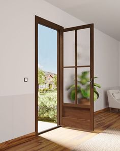 an open door with a potted plant in the corner and a window to the outside