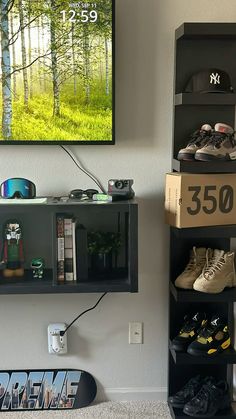 there is a skateboard and some shoes on the shelf next to it in this room