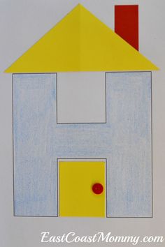 a child's drawing of a house made out of colored paper with the letter h on it