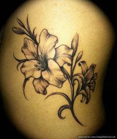 the back of a woman's stomach with flowers on it