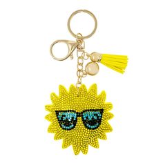 a yellow keychain with sunglasses on it