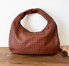 Thanksgiving Day Promotion 30% off. *Note: Due to the weaving process and design, this bag is a little stiff. and it very slim, so it could not stand if it do not have the support. Please know this before purchase. Prepare gift for wife, mother, girlfriends and women for Birthday Wedding and Anniversary Purely Hand-woven bag Women Vegan Leather large capacity tote bag women handbag ★★Crafts: Weaving is an ancient and creative craft that can transform ordinary threads or leather into beautiful wo Brown Handheld Bag With Intrecciato Weave, Hobo Bag With Intrecciato Weave, Everyday Hobo Bag With Intrecciato Weave, Everyday Intrecciato Weave Pouch Shoulder Bag, Brown Handheld Shoulder Bag With Intrecciato Weave, Brown Intrecciato Hobo Bag For Daily Use, Brown Intrecciato Weave Hobo Bag For Daily Use, Brown Intrecciato Weave Handheld Shoulder Bag, Mac Book