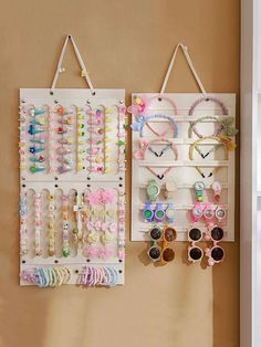 two wall hangings with sunglasses and hair clips on them