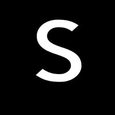 the letter s is shown in white on a black background and it appears to be made out of paper