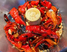 red peppers and other vegetables are mixed together in a food processor to make an appetizer