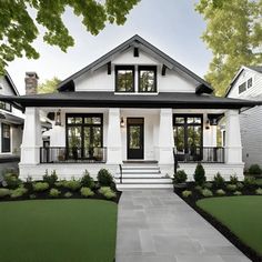 a white house with black trim and windows