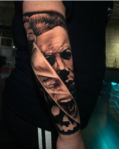 a man's arm with an image of the joker and his face on it