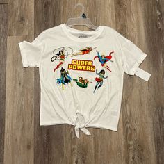 a white t - shirt with the words super powers printed on it