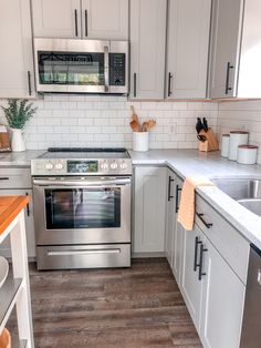 the kitchen is clean and ready for us to use it's stainless steel appliances