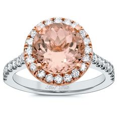 an oval cut morganite and diamond ring in rose gold with diamonds around the band