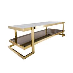 a white and gold coffee table with two shelves on each side, against a white background