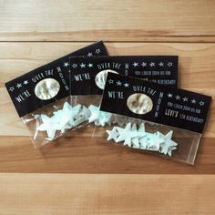 three pack of stars and moon stickers on a wooden surface