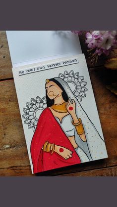 a card with a drawing of a woman wearing a veil and holding a flower in her hand