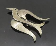 BEAUCRAFT 925 Sterling Silver - Vintage Modernist Dove Bird Brooch Pin - BP7127  BEAUCRAFT 925 Sterling Silver - Vintage Modernist Dove Bird Brooch Pin - BP7127  Jewelry Type:         Brooch Pin   Metal Type:            925 Silver   Metal Size:             2.25"  Stone Type:            N/A  Condition:              N/A  Jewelry Weight:     9.2 Grams  PLEASE NOTE: THIS ITEM IS PRE-OWNED. ALTHOUGH MOST ITEMS ARE IN VERY GOOD CONDITION, SOME MAY NEED CLEANING AND/OR MINOR REPAIRS. WE MAKE A VERY STR Dove Jewelry, Dove Bird, Hood Ornaments, Bird Brooch, Beautiful Rings, Types Of Metal, Silver Fashion, Brooch Pin, Brooches