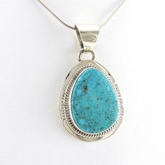 This genuine Arizona Kingman turquoise stone is set with sterling silver by Navajo artisans Burt and Kathy Francisco. Pendant is 1 1/2 inches long and 7/8 inch wide and is sold separate from the silver snake chain shown. Style Number: 17631 Metal: 925 Sterling Silver Gemstone: Genuine Kingman Turquoise Dimensions: 1 1/2 inches long and 7/8 inch wide Handmade in USA Artisan Turquoise Jewelry With Polished Finish, Southwestern Sterling Silver Turquoise Necklace With Large Stone, Collectible Turquoise Sterling Silver Necklace, Southwestern Sterling Silver Jewelry With Large Stone, Southwestern Turquoise Sterling Silver Jewelry, Untreated Sterling Silver Southwestern Jewelry, Southwestern Style Turquoise Sterling Silver Jewelry, Southwestern Style Turquoise Jewelry In Sterling Silver, Traditional Turquoise Sterling Silver Necklace