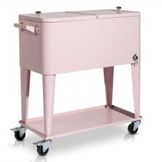 a pink cooler sitting on top of a metal cart