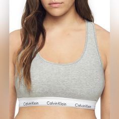 Calvin Klein Women's Modern Cotton Unlined Racerback Bralette Gray/White Size Xl New With Tag. Msrp $30 53% Cotton, 35% Modal, 12% Elastane Less Is More: Unlined And Underwire-Free, This Calvin Klein Bra Combines The Label’s Famously Sporty-Sexy Look With The Feel Of A Favorite Tee. Modern Cotton: Spun In Premium Cotton Yarns With Silky Modal And A Hint Of Stretch, Ck’s Signature Bras For Women Are Lightweight, Super-Soft And Breathable. Effortless: An Easy, Pullover Raceback Silhouette Makes Dr Ck Grey Bra, Calvin Klein Bra, Wireless Bra, Calvin Klein Woman, Less Is More, Womens Calvin Klein, Cotton Yarn, The Label, Gray White