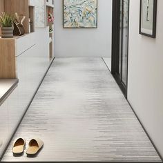 a pair of shoes sitting on the floor in a hallway