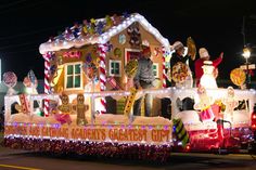 a house covered in christmas lights and decorations