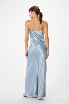 Experience the timeless presence of elegance with the SOPHIE RUE Ella Satin Slip Maxi Dress. Crafted with luxuriously soft satin, this slip dress moves with graceful fluidity and features adjustable spaghetti straps, a V-neckline, and a high slit for a flash of skin. Fully lined with a bias cut, this classic design will lend effortless grace to any affair - casual or formal. ** Sizing notes: This style runs TTS. Model is 5'8" and wearing a size S. MATERIALS: 53% Rayon 47% Viscose CARE: Hand wash Slip Maxi Dress, Satin Slip, Satin Dress, Slate Blue, Black Friday Sale, Satin Dresses, Fabric Care, Spaghetti Strap, Slip Dress