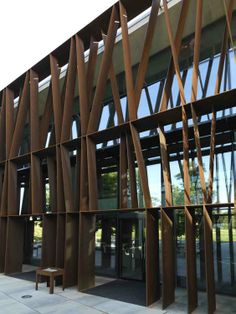 a large building with wooden slats on the outside