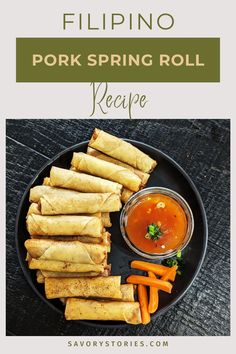 a plate filled with fried spring rolls and carrots next to dipping sauce on the side