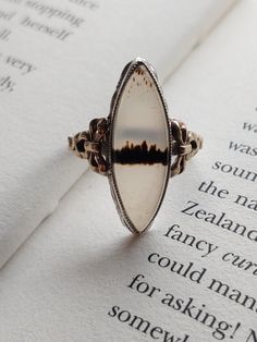 "Vintage Art Deco style Sterling Silver and 10k accent Moss agate Ring. Size is right about 6.5\" US This is a used item with scuffs from age, please view pictures. Basic info: Size- Approx. 6.5\" US Color: Silver / Grey Type- Silver work and gold Cut- Oval weight- approx. 3.5g Silver Mark-  Sterling and 10k Maker Mark - ? (cannot make out) SHIPPING: All orders are guaranteed to ship the same or following day. If your purchase occurs on a Sunday you may request UPS shipment as the post office is closed. Shipping in the United States usually takes 3-4 days" Formal Oval Jewelry With Natural Inclusions, Oval Jewelry With Natural Inclusions For Formal Occasions, White Agate Cabochon Jewelry, Vintage Jewelry With Natural Inclusions For Weddings, Wedding Agate Cabochon Jewelry, Elegant Opal Ring With Natural Inclusions, Elegant Round Opal Ring With Natural Inclusions, Vintage Wedding Jewelry With Natural Inclusions, Antique Oval Agate Jewelry