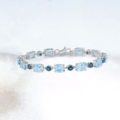 Ross-Simons - 23.10ct t. w. London, Sky Blue Topaz Bracelet in Silver. 8". Wrap your wrist in beautiful tones of blue. This bracelet features 23.10 ct. t. w. London and sky blue topaz in polished sterling silver. Lobster clasp, blue topaz bracelet. Blue Topaz birthstones are the perfect gift for December birthdays. Fine Jewelry Blue Topaz Bracelets, Elegant Blue Aquamarine Bracelets, Luxury Blue Gemstone Tennis Bracelet, Luxury Blue Topaz Gemstone Bracelets, Elegant Light Blue Aquamarine Bracelet, Luxury Blue Bracelets With Gemstone Accents, Luxury Blue Sterling Silver Diamond Bracelet, Luxury Blue Sterling Silver Round Bracelet, Luxury Blue Gemstone Sterling Silver Bracelet