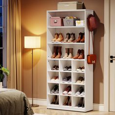 a white shoe rack filled with shoes next to a lamp and bed in a room