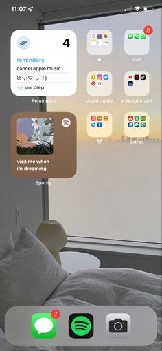 an iphone screen with several different icons on it and a window in the back ground