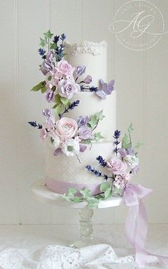 a three tiered cake with flowers on it