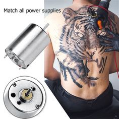 a man with a tiger tattoo on his back and an electric device attached to it