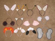 several ears and headbands are laid out on the floor, including bunny ears