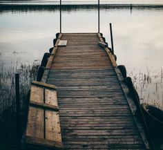 a wooden dock sitting next to a body of water