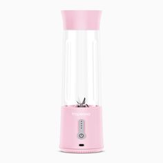 a pink blender sitting on top of a white table