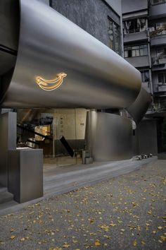 the entrance to an office building with a large banana sign on it's side