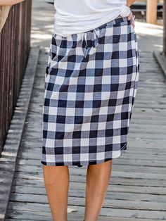 Looking for a weekend skirt that's both cozy and stylish? Look no further than our Buffalo Plaid Weekend Skirt! This skirt is the perfect combination of cute and comfortable, with a knee-length cut and a self-tie waistband that'll keep you feeling feminine and put-together all day long. Whether you're running errands or meeting up with friends for brunch, this skirt is sure to turn heads. And with sizing options ranging from S to 3X, it's easy to find the perfect fit for your body type.So why wa Casual Tie Waist Skirt For Vacation, Casual Tie Waist Skirt For A Day Out, Casual Knee-length Skirt For Daywear, Casual Tie Waist Skirt For Spring, Casual Spring Skirt With Tie Waist, Casual Skirt With Tie Waist For Spring, Casual Midi Skirt With Tie Waist, Casual Tie Waist Midi Skirt, Cotton Skirt With Tie Waist For Day Out