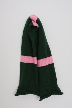 a green scarf with pink stripes on it