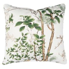 a white pillow with green leaves and branches on the front, against a white background