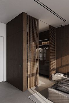 a bedroom with wooden slats on the walls and bed in the middle, next to a closet