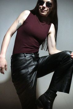 1990s VINTAGE LEATHER High waisted black leather pants with straight, slightly bell bottom cut. The pants have a retro design with vertical seams along the front center complemented with hand stitching. The leather is lambskin, it is extremely soft and comfortable to wear.  YKK zipper fly, diagonal front pockets and classic rear pockets just complete the collection of cool details. If you love 90s vintage fashion, you will anojy wearing these pants!  BTW, did you know?: Leather is wind-proof by Womens Leather Pants, 90s Vintage Fashion, Square Toe Leather Boots, Motorcycle Pants, Leather Pants Women, Sitting Poses, Black Leather Pants, 2000s Vintage, Ribbed Knit Top