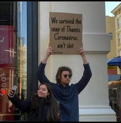 a man and woman holding up a sign that says stop sharing your post in your story