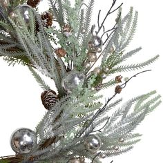 an evergreen branch with silver balls and pine cones