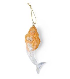 a glass mermaid ornament hanging from a cord