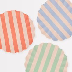 three paper plates with different colored stripes on them