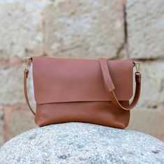 "Womens leather handbag handmade of full grain leather. Soft leather crossbody bag with a simple and timeless design. Our leather crossbody bag adapt to every lifestyle, we are always going from one place to another and we need to carry our things always with us, that's why this leather purse bag for women is perfect, also as a gift. It has great capacity, it is resistant, timeless design and very practical for every day use, for work, office, university, shopping, go to the grocery, and more. V Minimalist Smooth Grain Crossbody Bag, Minimalist Leather Crossbody Shoulder Bag, Gift Crossbody Shoulder Bag With Smooth Grain, Gift Smooth Grain Crossbody Shoulder Bag, Minimalist Soft Leather Crossbody Satchel, Minimalist Textured Leather Shoulder Bag, Simple Leather Shoulder Bag, Soft Leather Crossbody Bag, University Bag