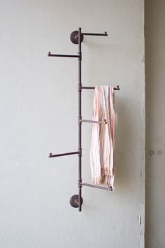 a towel rack is hanging on the wall