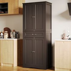 a tall brown cabinet sitting in the middle of a kitchen